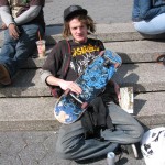 skater with dreadlocks with board