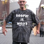 bum in "Keepin it weird" shirt