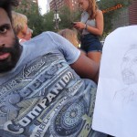 black artist with drawing of photographer