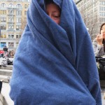 woman wrapped in blue blanket