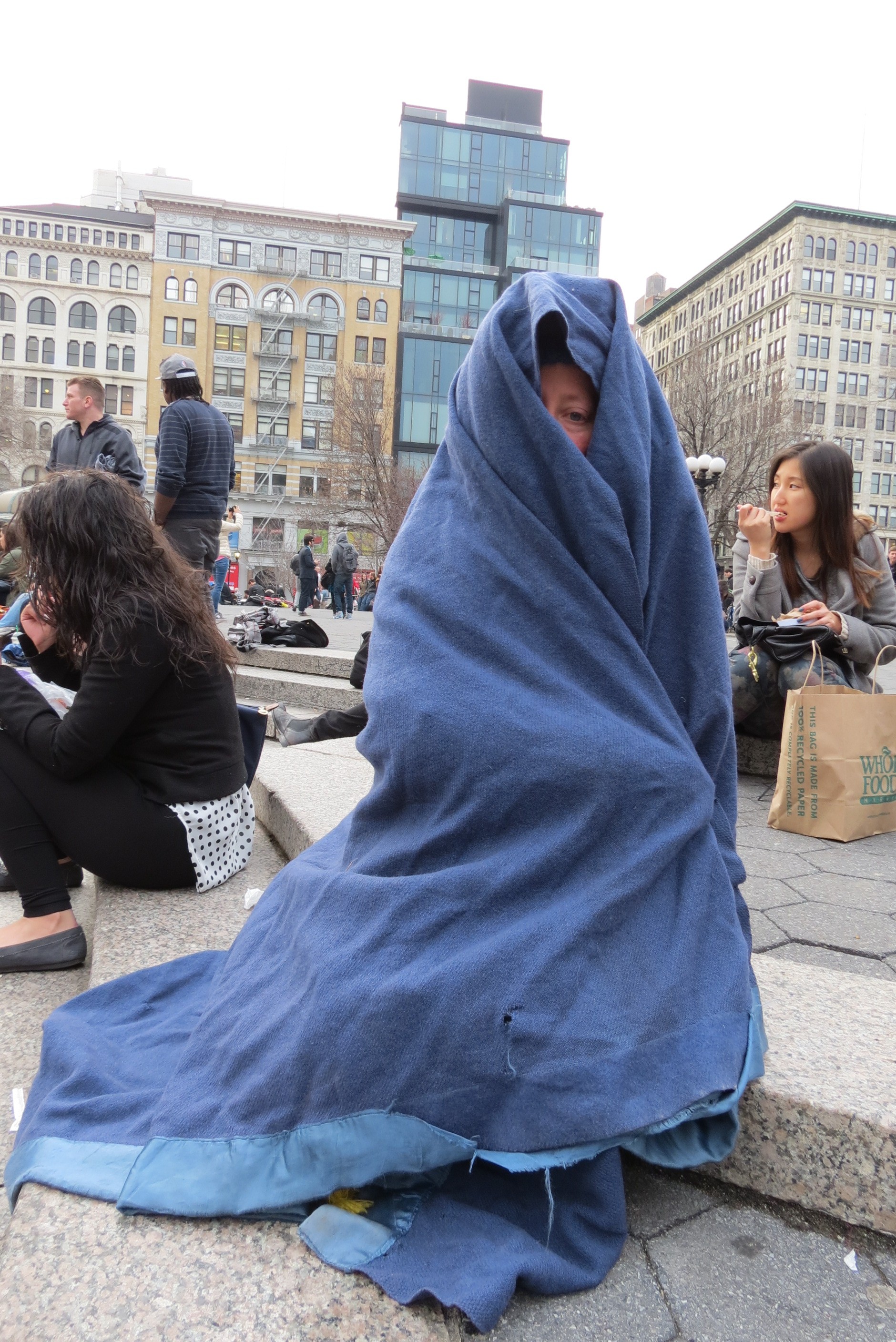 woman wrapped in blue blanket