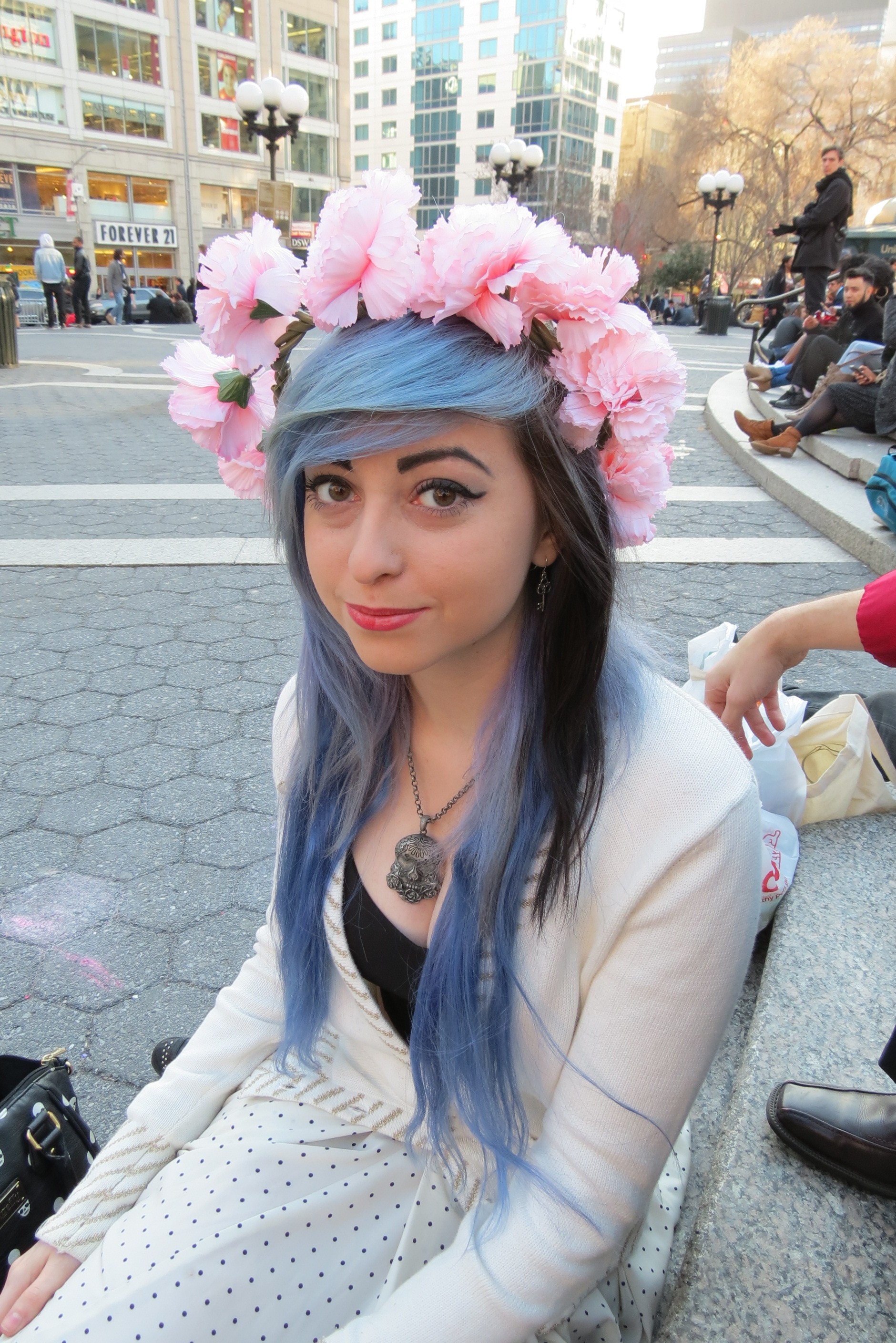 Black & blue haired girl with crown of pink flowers