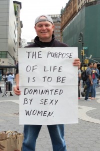 man with funny sign