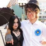Goth girl with street performer
