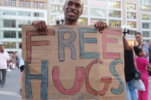 Boy with Free Hugs sign