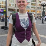 happy girl with purple hair and vest
