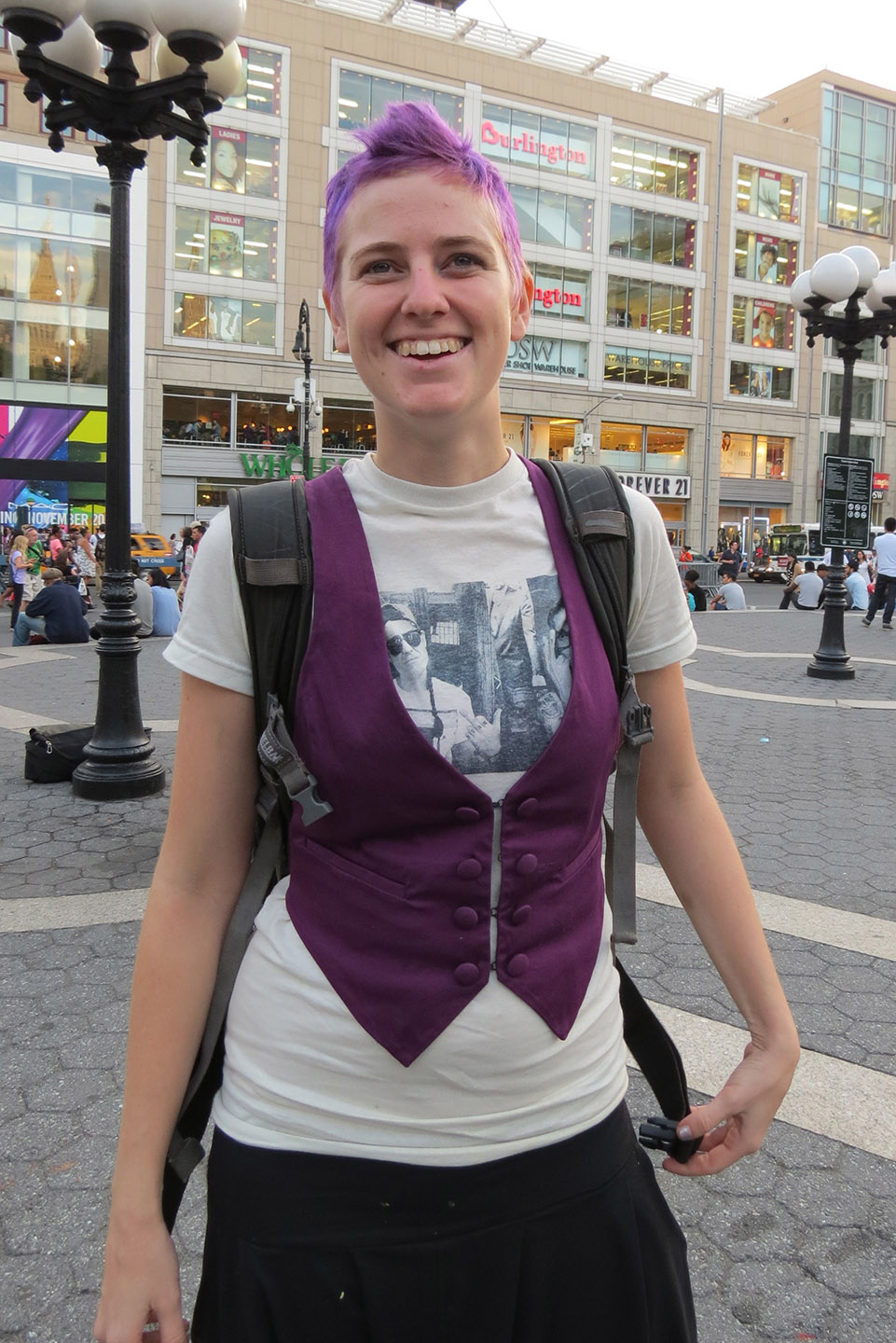 happy girl with purple hair and vest