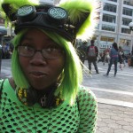 Black girl in green wig & cat ears