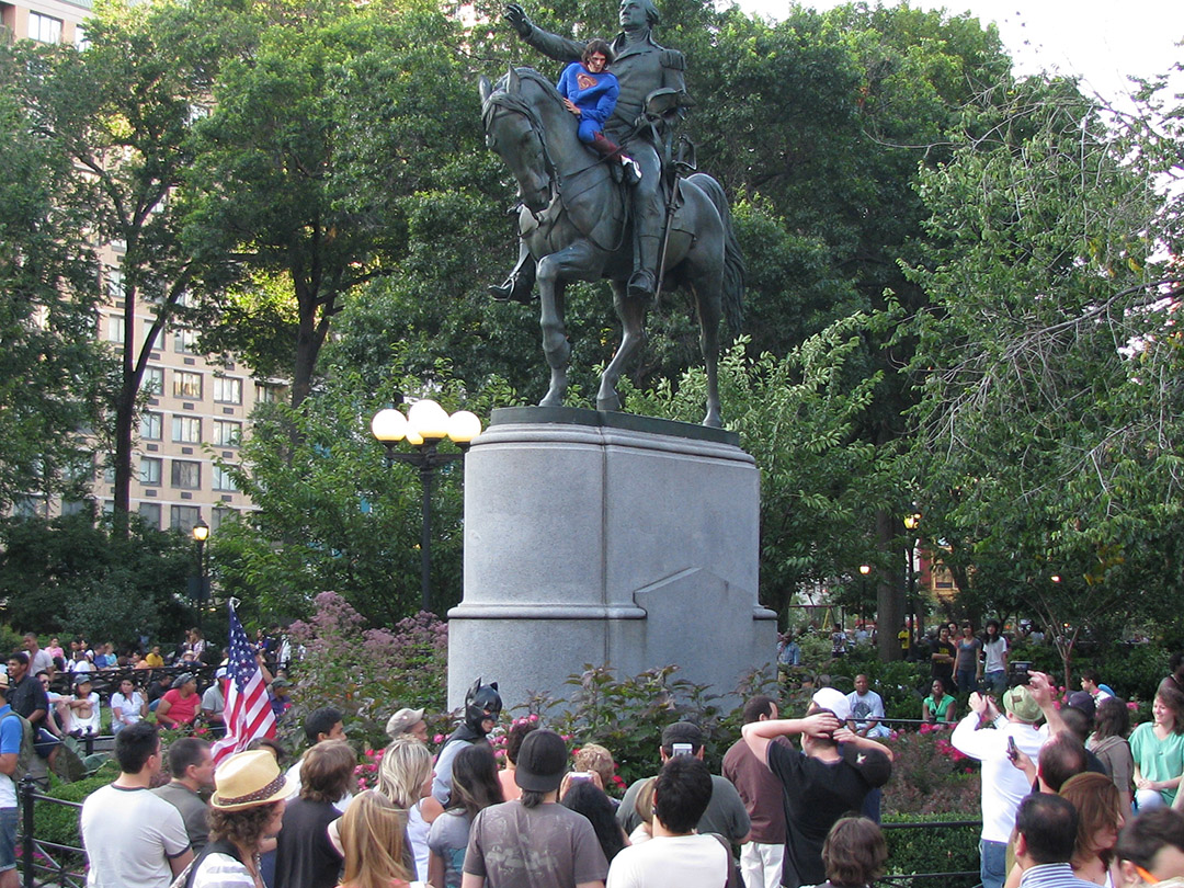 Man dressed as Superman climbs washington statue at union square