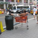 Man lounging in Shopping Cart Aug 24, 2009