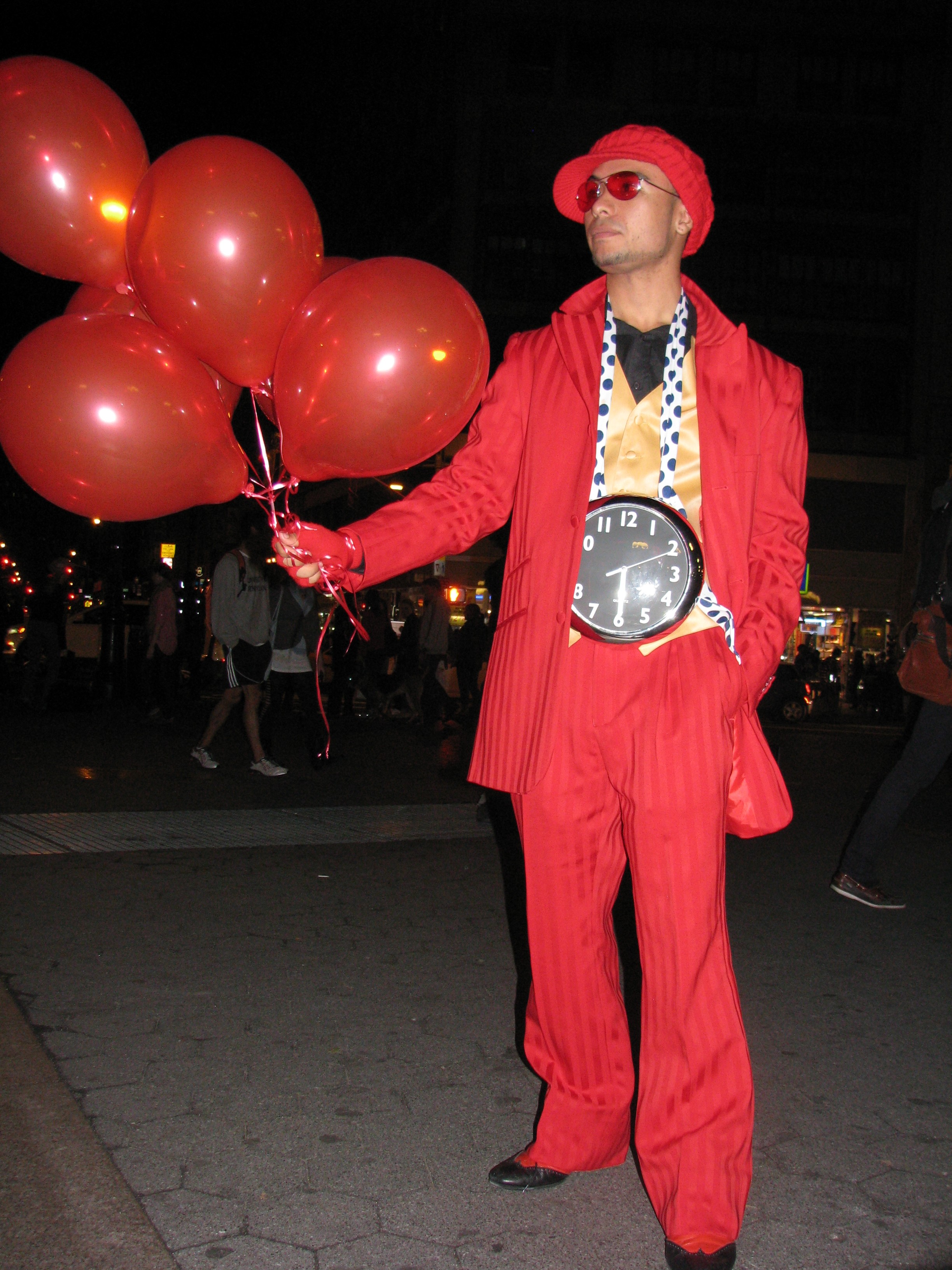 Man dressed in red with balloons