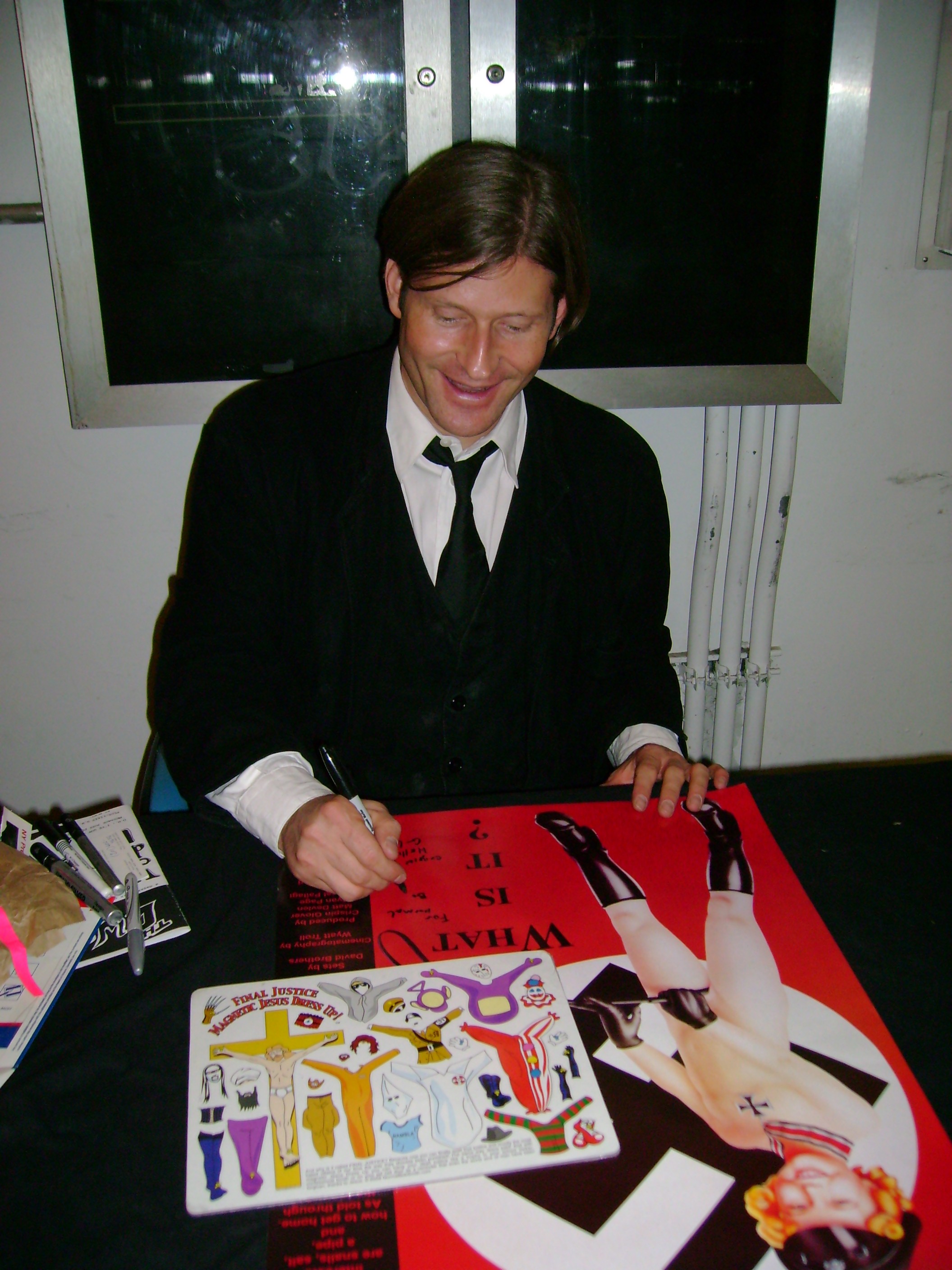 Crispin Glover laughing nervously at offensive magnets