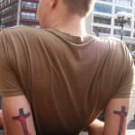 man with Crucified Satan tattoos