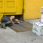 Homeless punk asleep on street