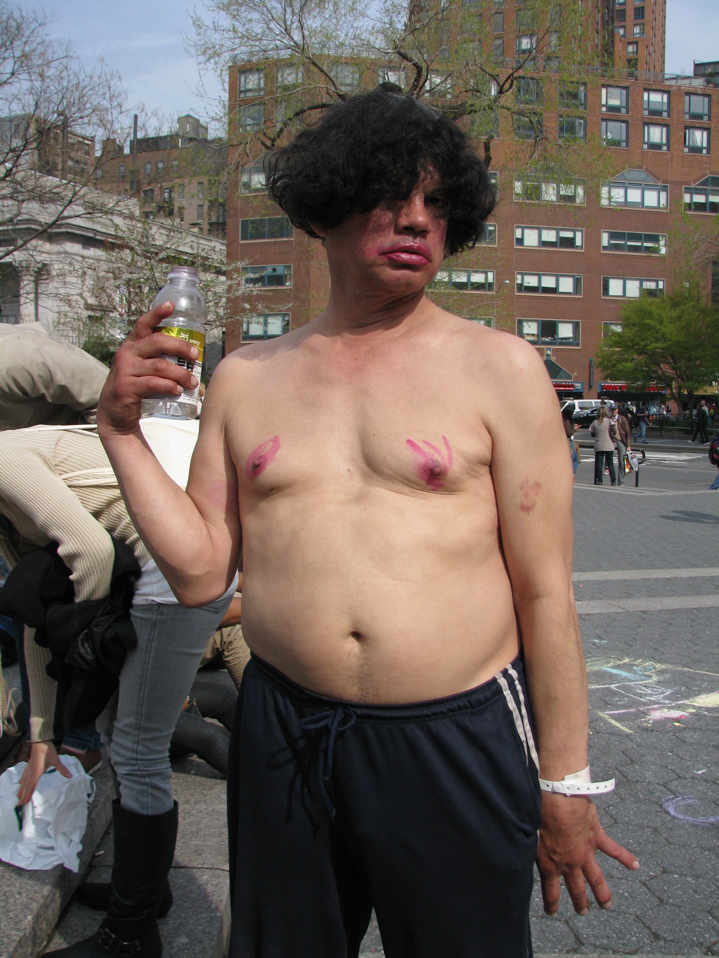Weird man with lipstick on his nipples