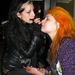 two rocker girls putting on makeup