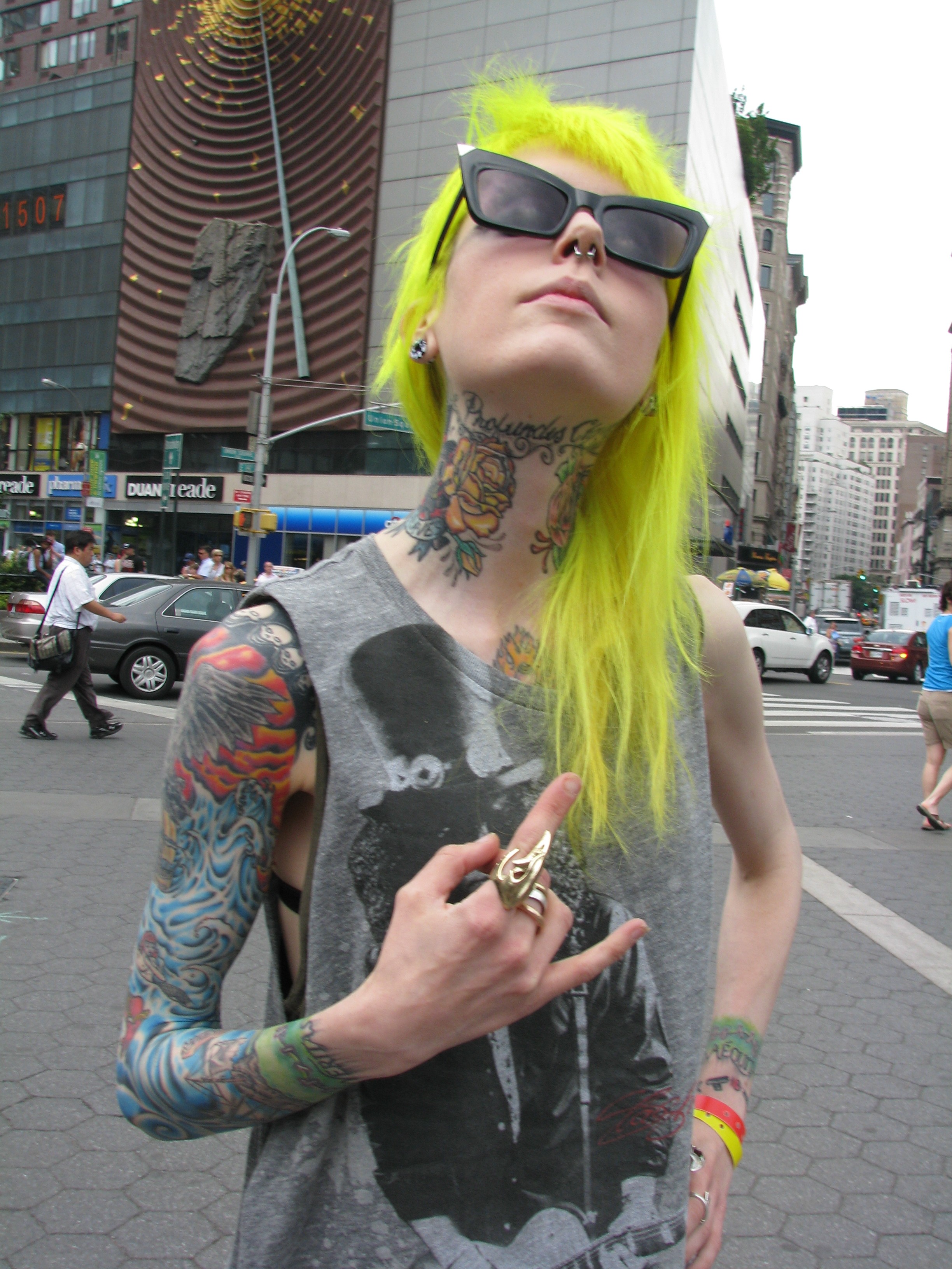 skinny punk tattooed girl with bright yellow hair