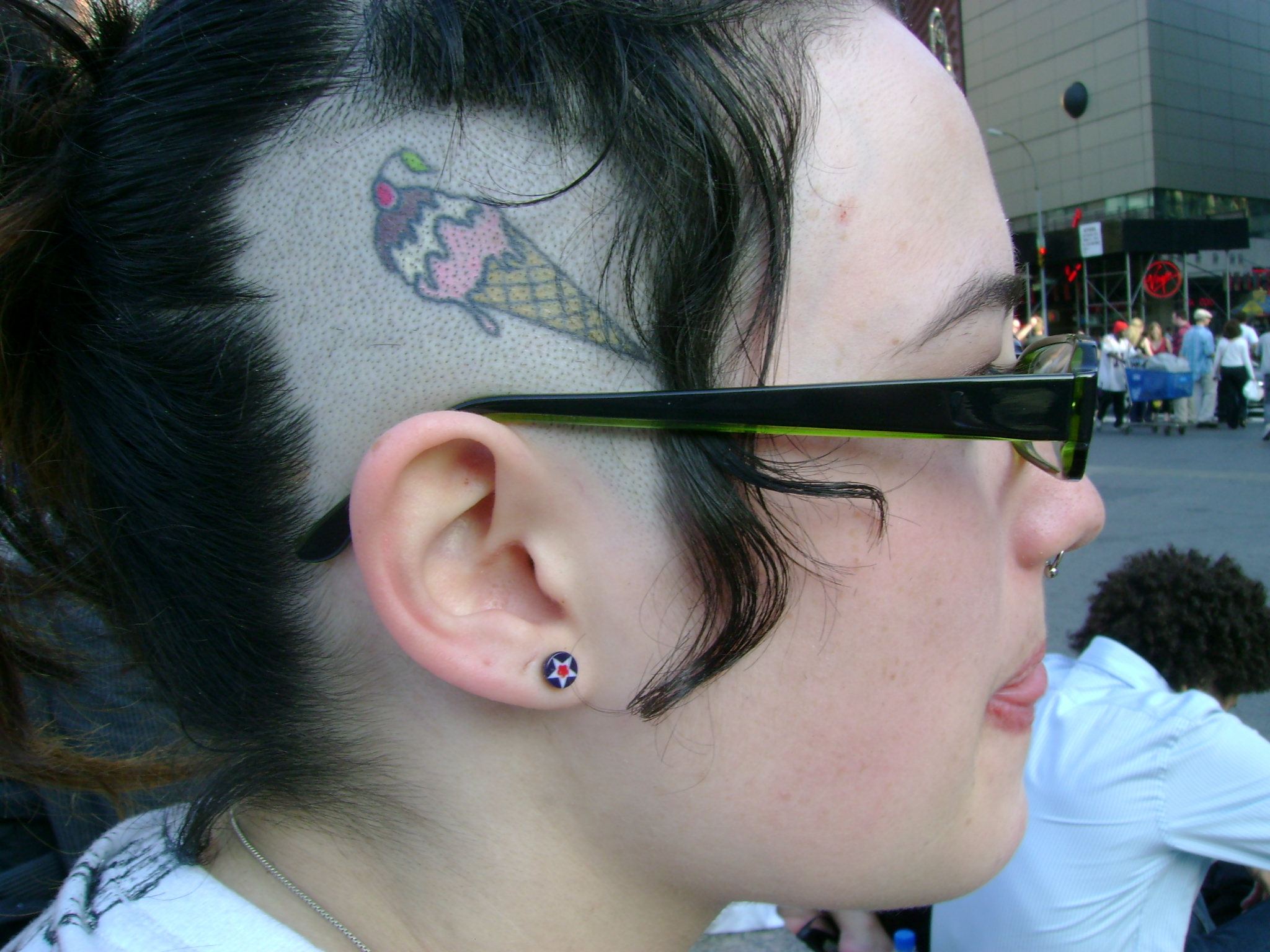 girl with ice cream cone tattoo on scalp