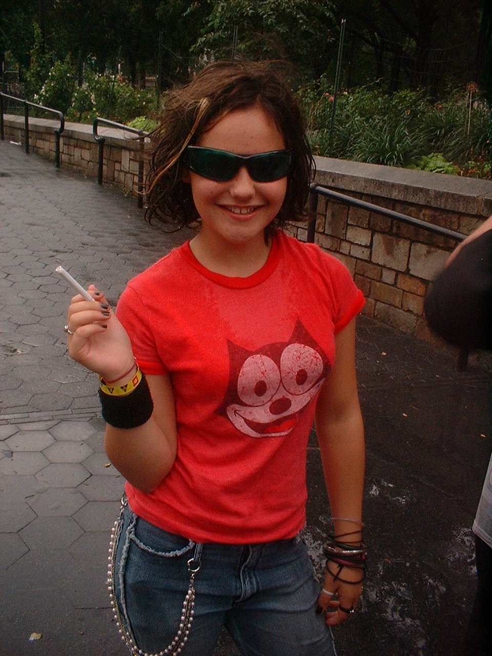 young girl in sunglasses and cigarette