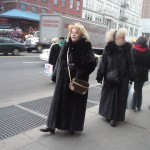 Blonde women in black fur coats