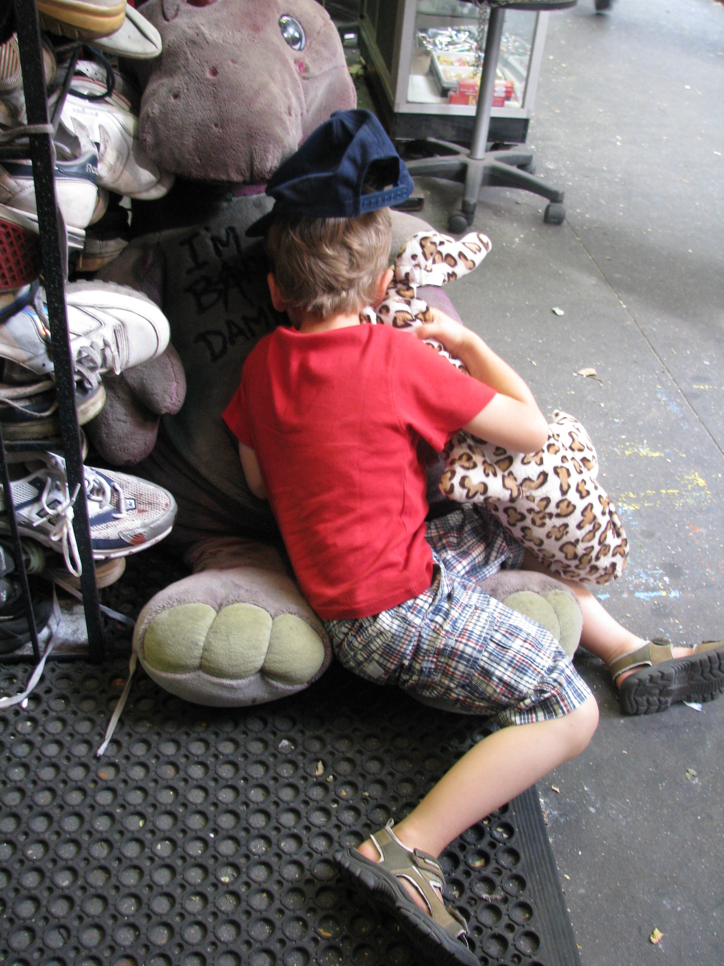 Kid hugging Barney Toy
