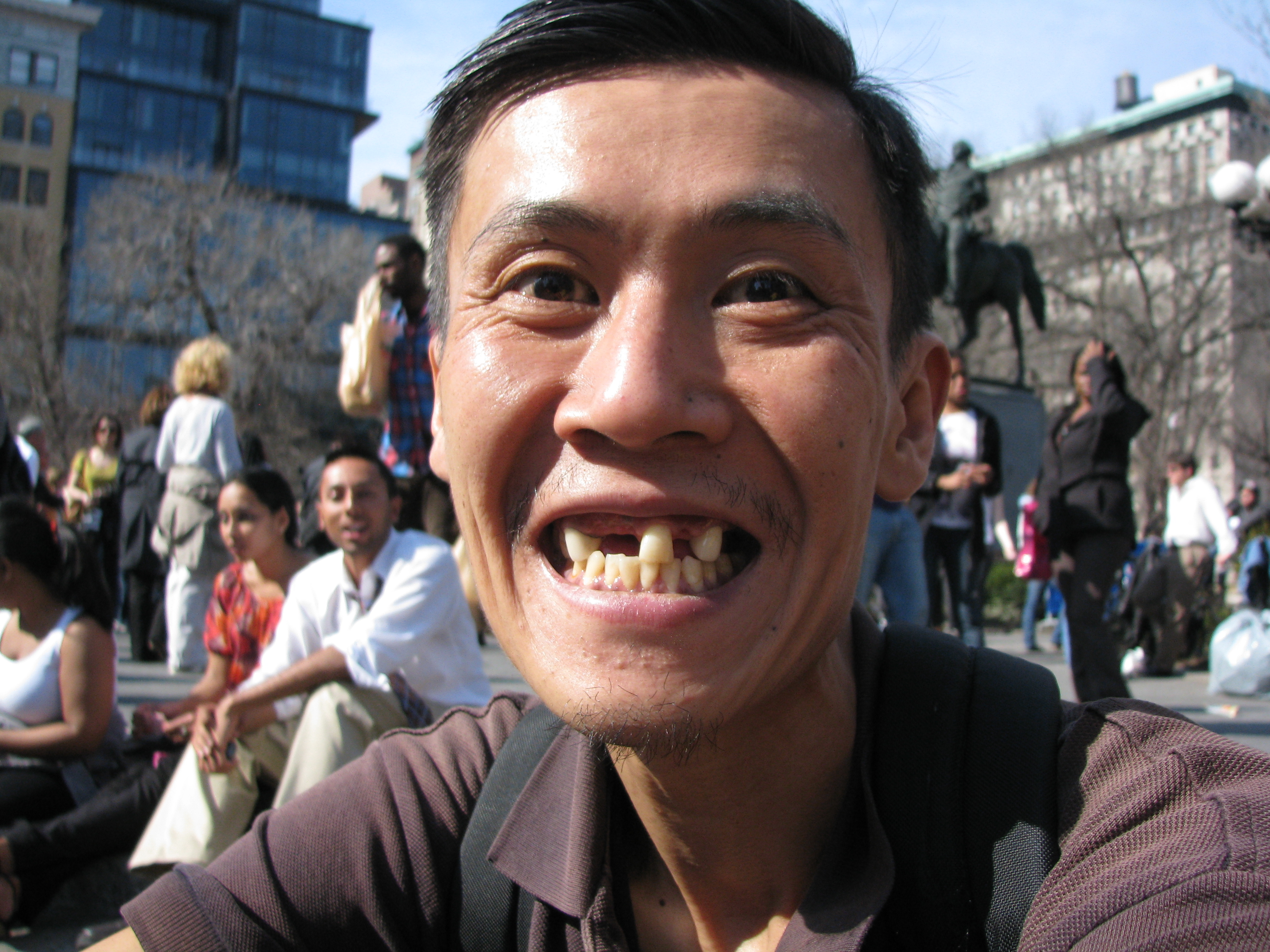 asian man with missing teeth