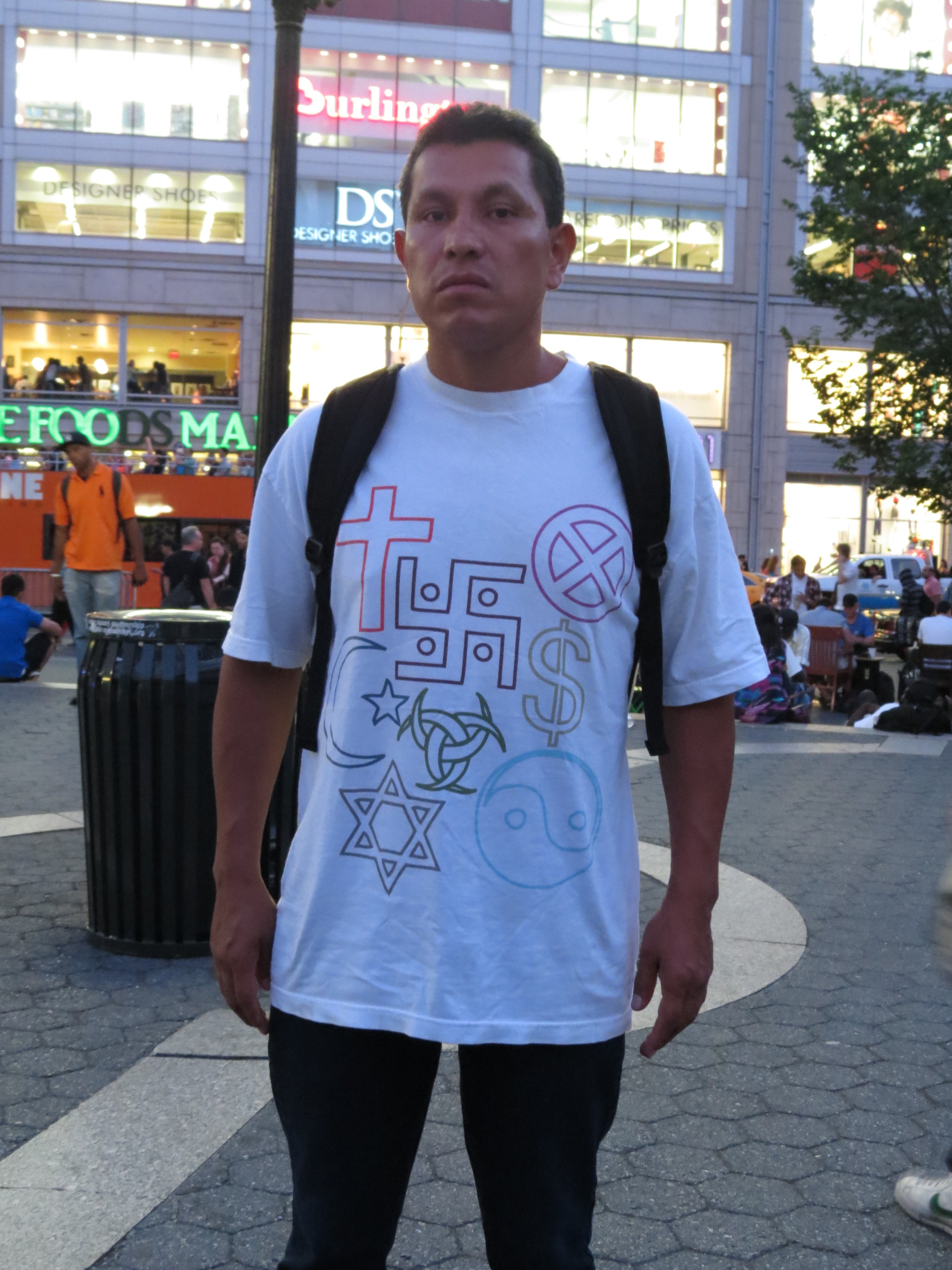 Man wearing shirt with Swastika & other symbols