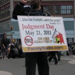 Man w/May Judgment Day sign