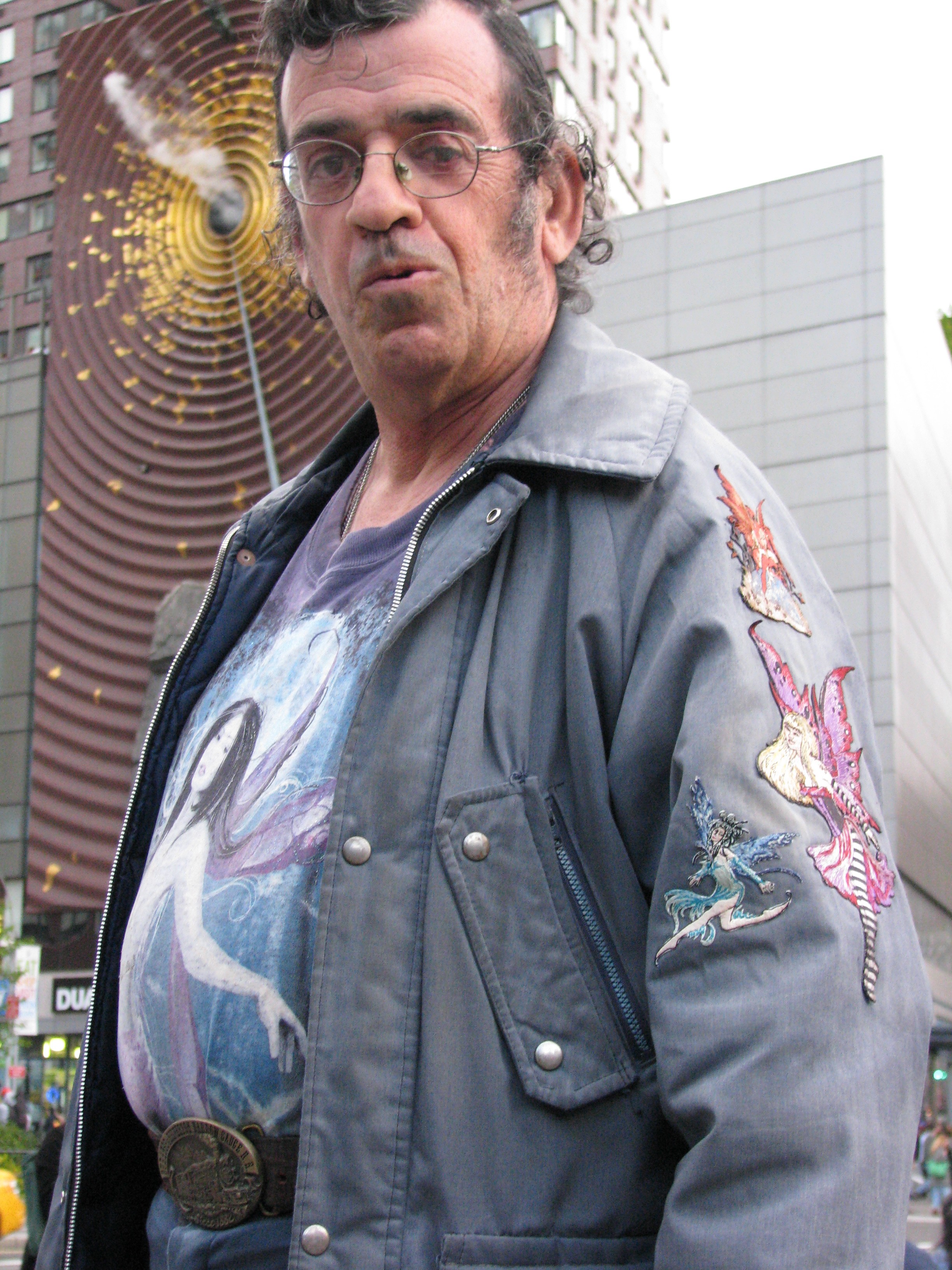 Jeffrey Babbitt poses in front of smoking art