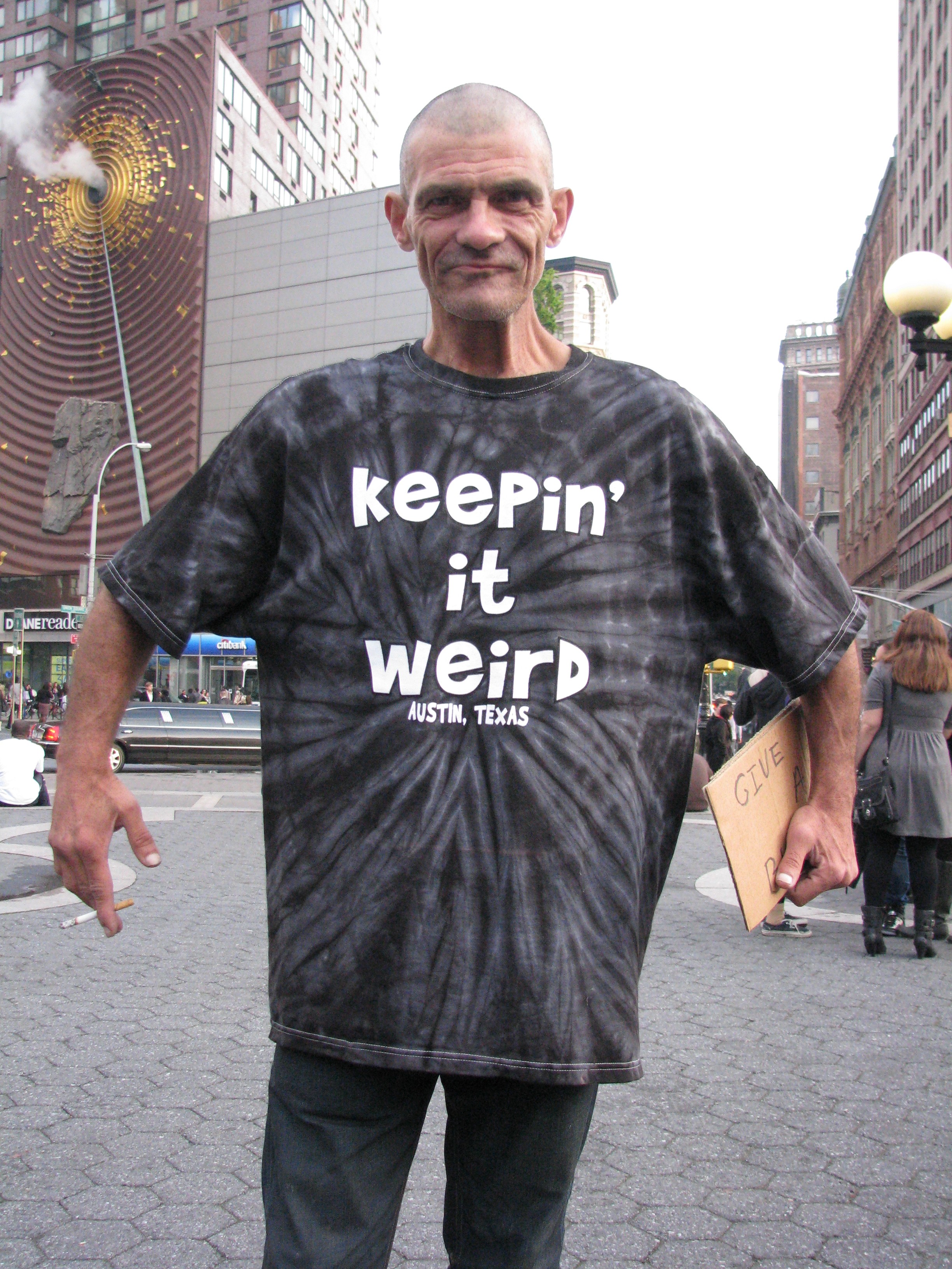 bum in "Keepin it weird" shirt