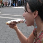 Woman eating chocolate pizza from Max Brenner's (weird teeth)