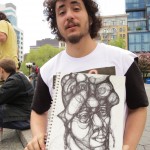 artist holding up his drawing