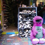 Barney stuffed toy outside of Boris's Shoe Repair
