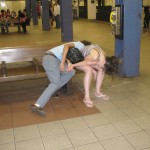 Couple passed out on subway bench