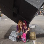 Asian Mall Punks sitting under The Cube at Astor Place