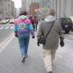 Woman in ugly coat with target on back