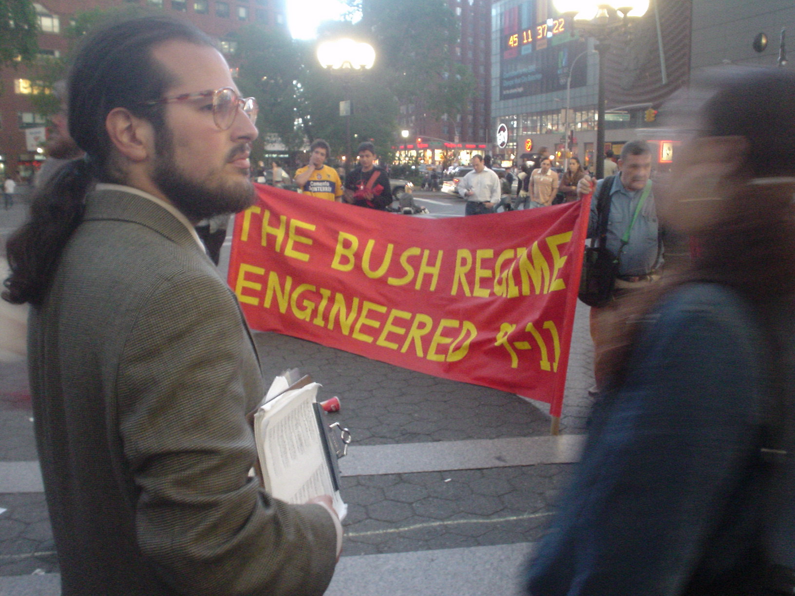 Jason Blank with BOSH REGIME ENGINEERED 9-11 banner
