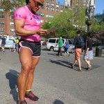Female bodybuilder Suha Qasem looking at the Union Square postcard