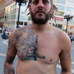 crusty punk with upside down crucifix tattoo